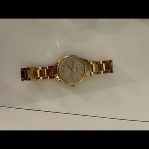 Gold fossil watch